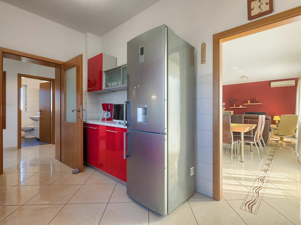 Cabinetry, Furniture, Building, Door, Kitchen, Chair, Hall, Refrigerator, Flooring