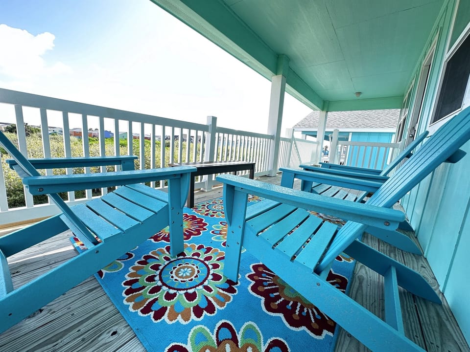Shaded front balcony with seating great for morning coffee and or evening relaxing..