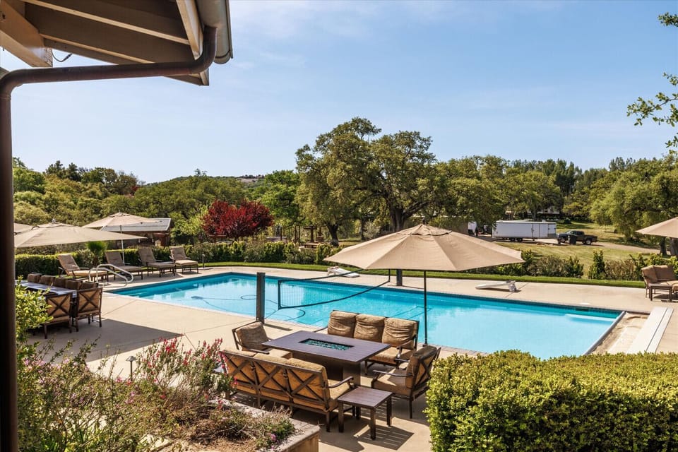 Large pool deck with resort style furniture