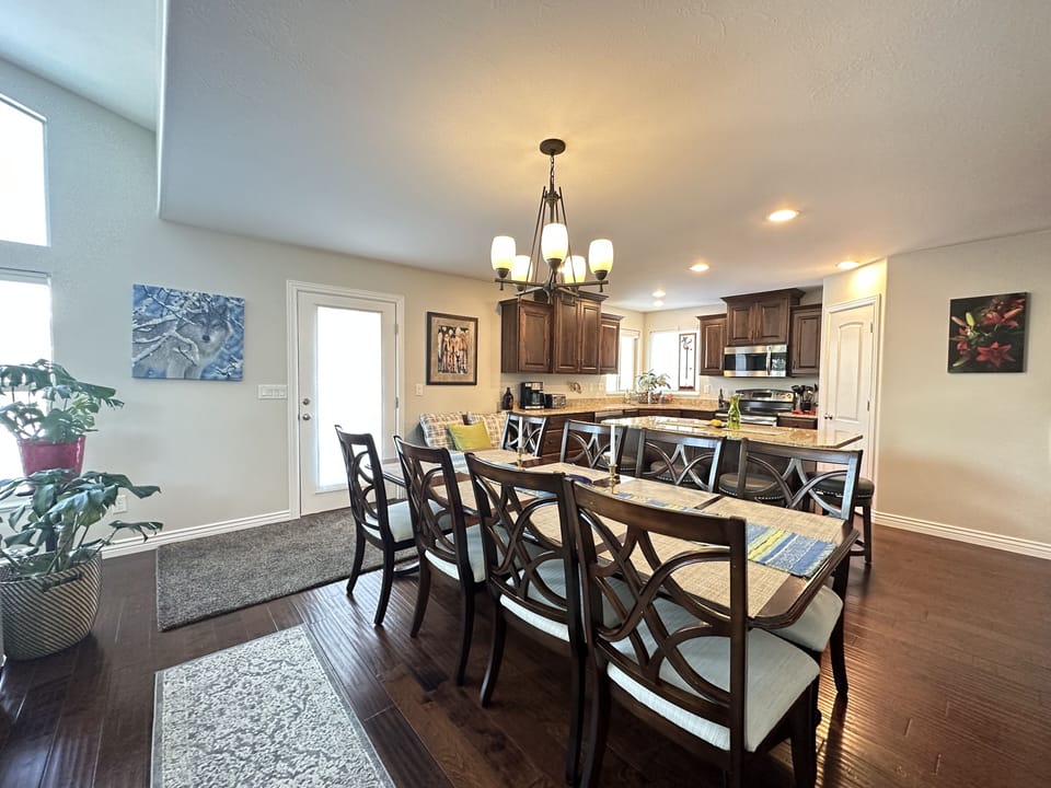 Dining table seats 8 with an additional 4 at the center Island.