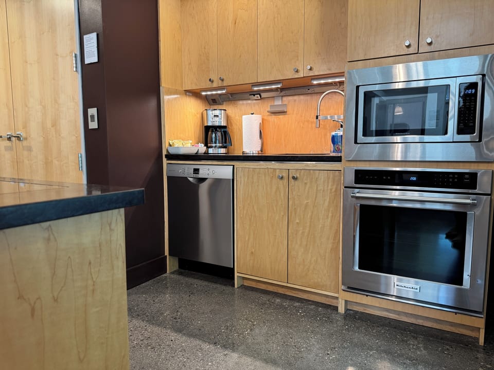 High end kitchen appliances and coffee bar.