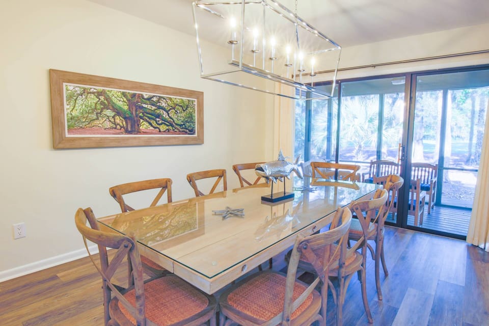 The dining room also features terrific views of the backyard and has sliding door access to the screened porch.