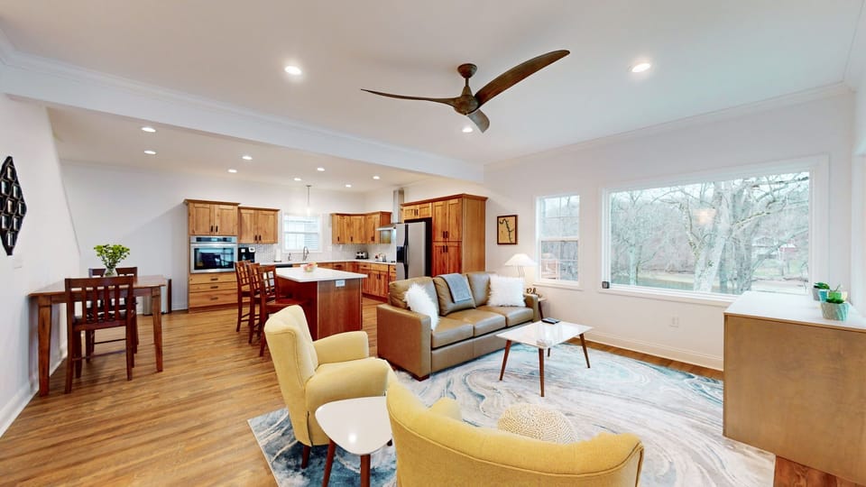 Living room with large picture window view of the cove