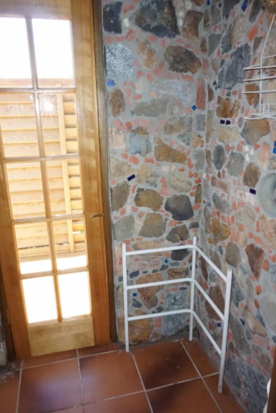 The shower is graced with St John-style stonework