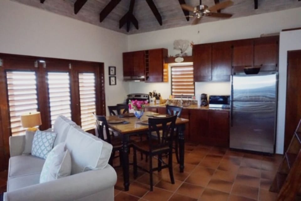 A well-equipped kitchen with indoor dining area