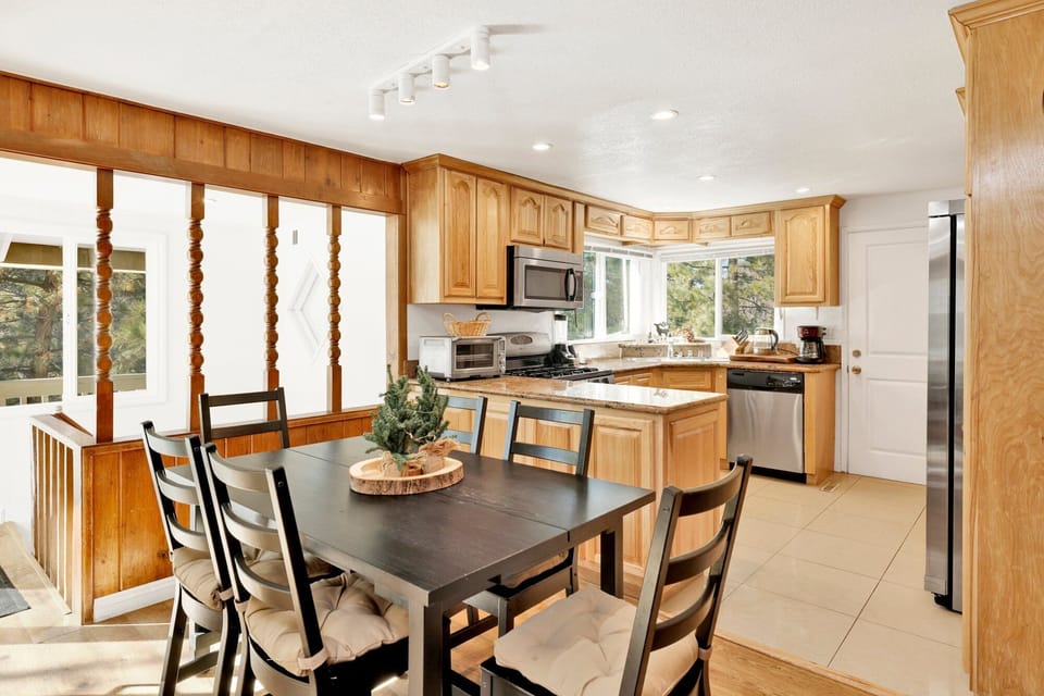 Bright dining space steps from the living room, inviting family gatherings and cozy evenings