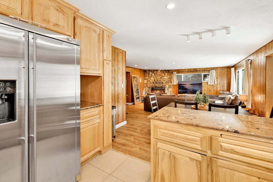 Bright kitchen with breakfast bar, inviting guests to gather and enjoy shared meals