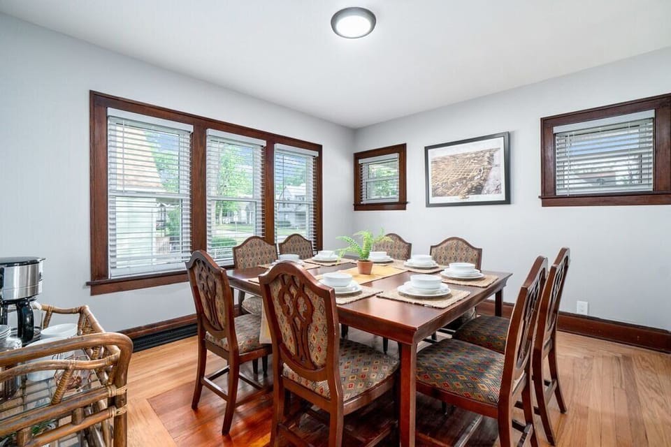 Large dining room table with seating for eight.