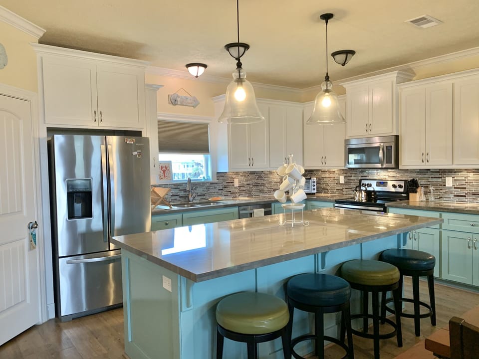Kitchen and island with seating.