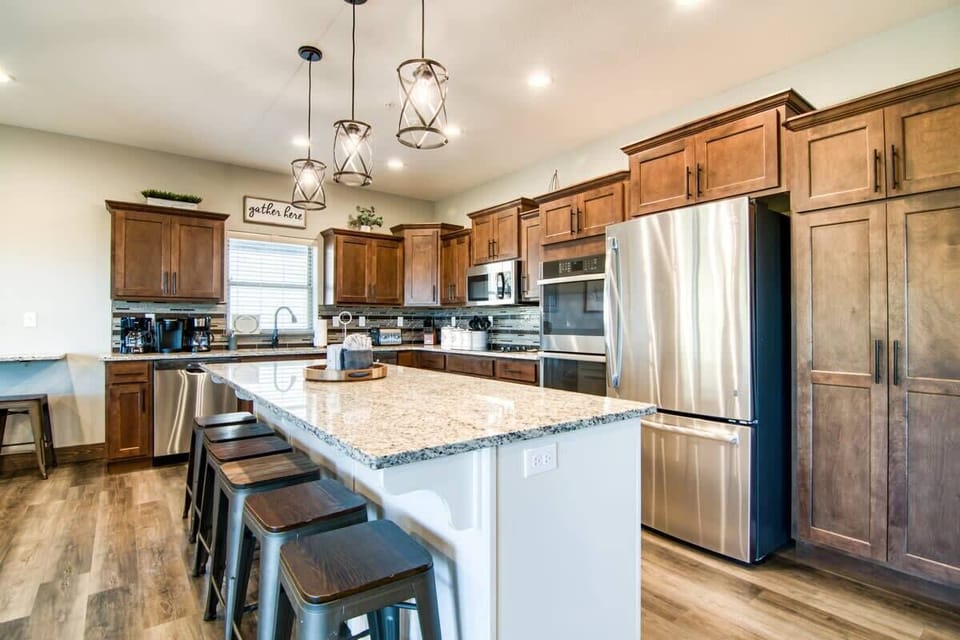 The oversized kitchen island will be the perfect place to prep for any home cooking!