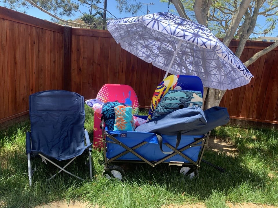 Complimentary beach supplies! Umbrellas, chairs, towels, & boards in beach wagon