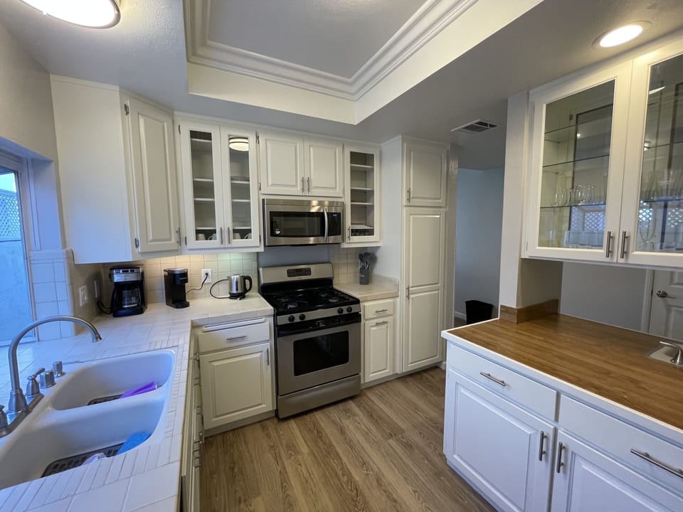 Kitchen with gas range, LG Refrigerator, new dishwasher, over range microwave