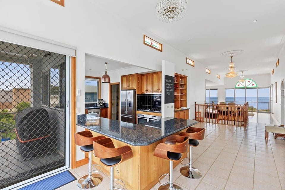 Guests rave about the functionality and style of the kitchen, and bay views from the BBQ area on the rear balcony