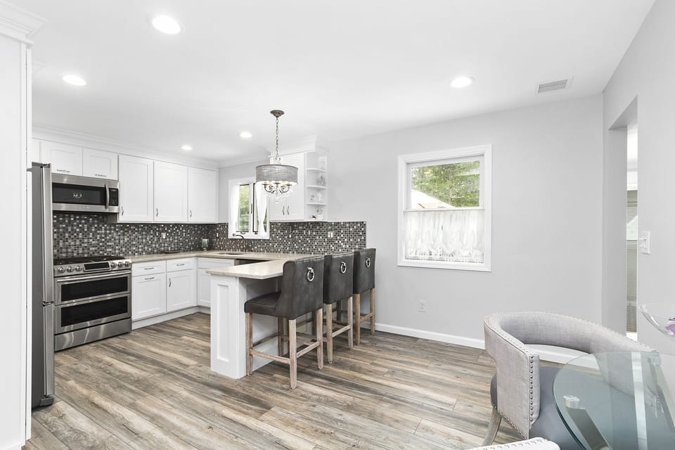 small open dining area connected to kitchen and living area