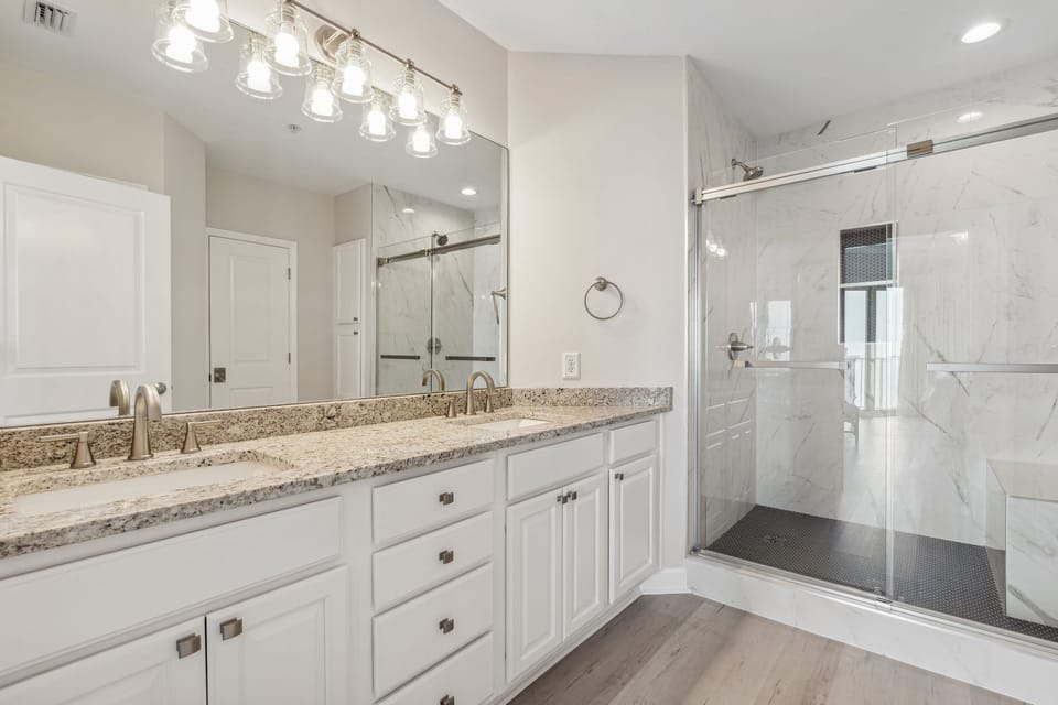 Master Bath.  Brand new tile walk in shower with 2 shower heads and bench.
