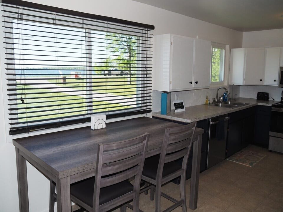 DINING AREA:  The home has a cute little dining area next to the kitchen that also a good view of Manistee Lake.