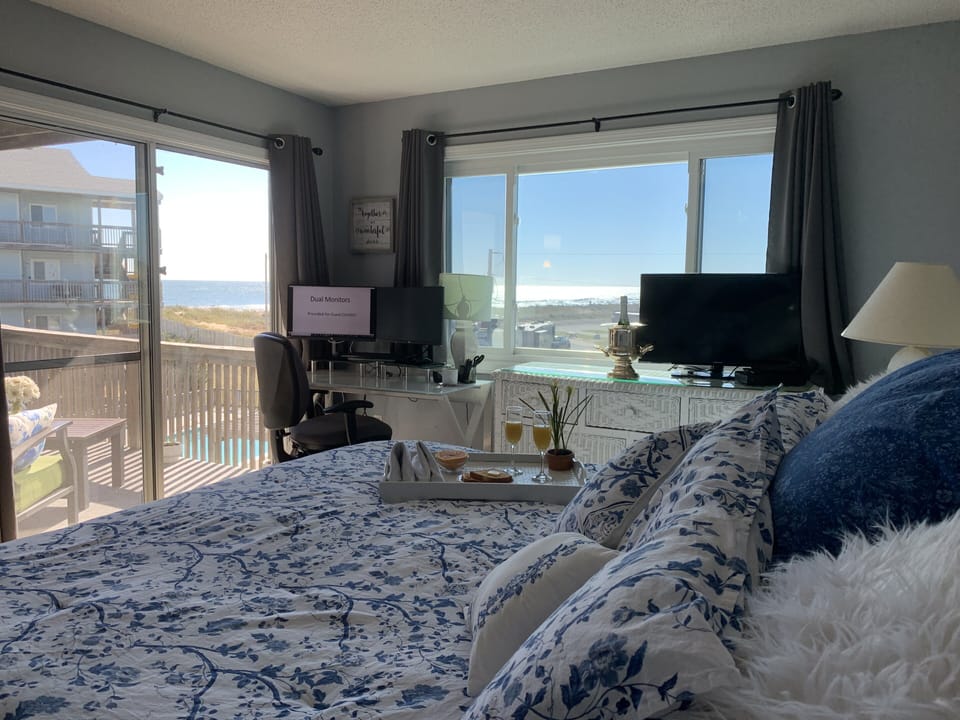 Sun drenched master bed with black out curtains for sleeping in.