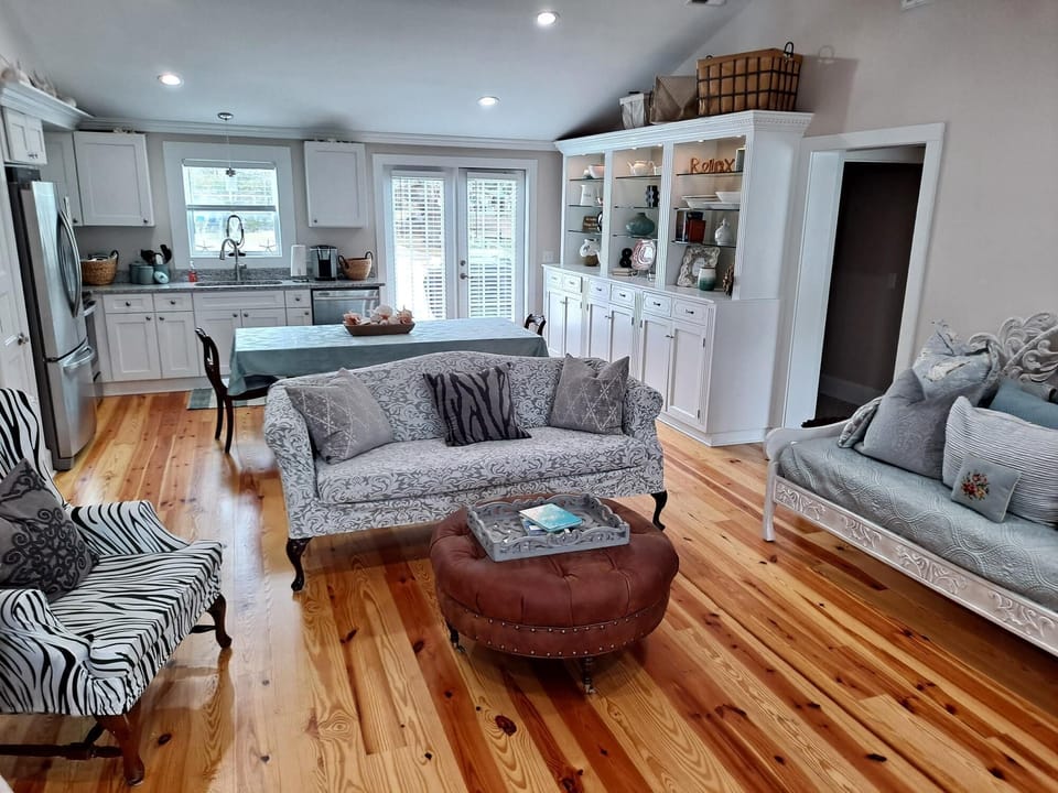 Large open concept Living room with exposed beams
