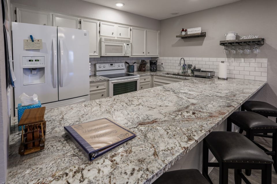 Open kitchen allows for great conversations over a glass of wine