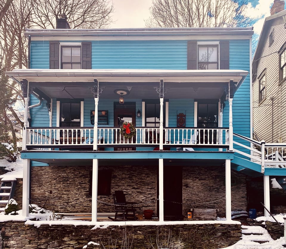 Blue portion of house is the rented portion; front door off of porch