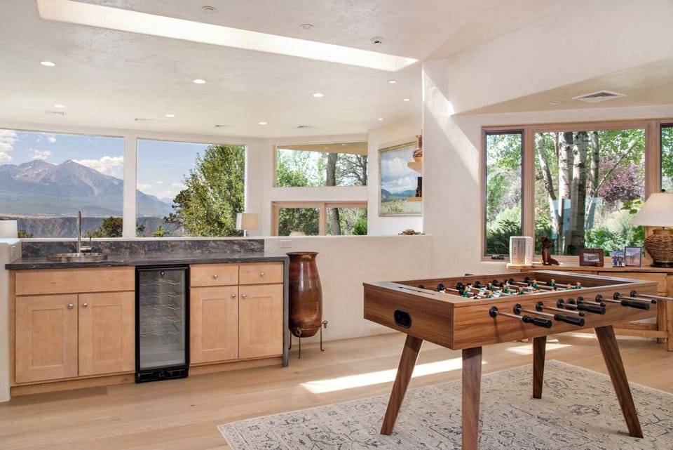 Main house ~ view of wet bar and foosball table from entryway