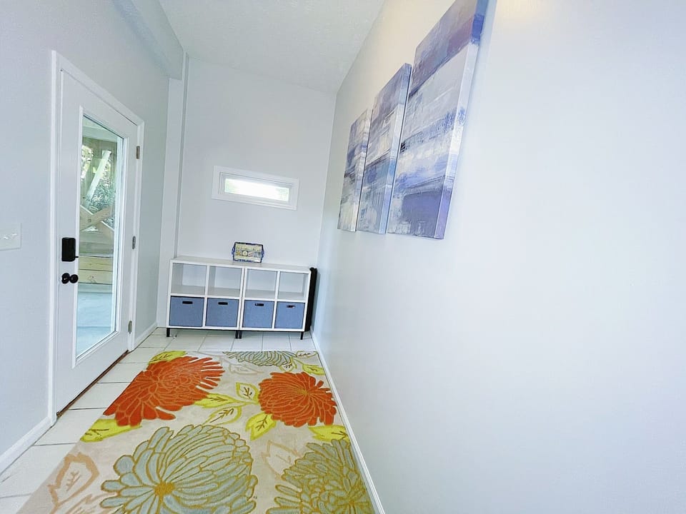 Entryway with cubbies, hooks, and bench for shoes/towels/beach bags