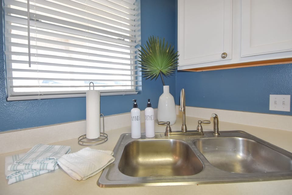 Kitchen sink. Stay comes with soap, dish towels, & wash rags!