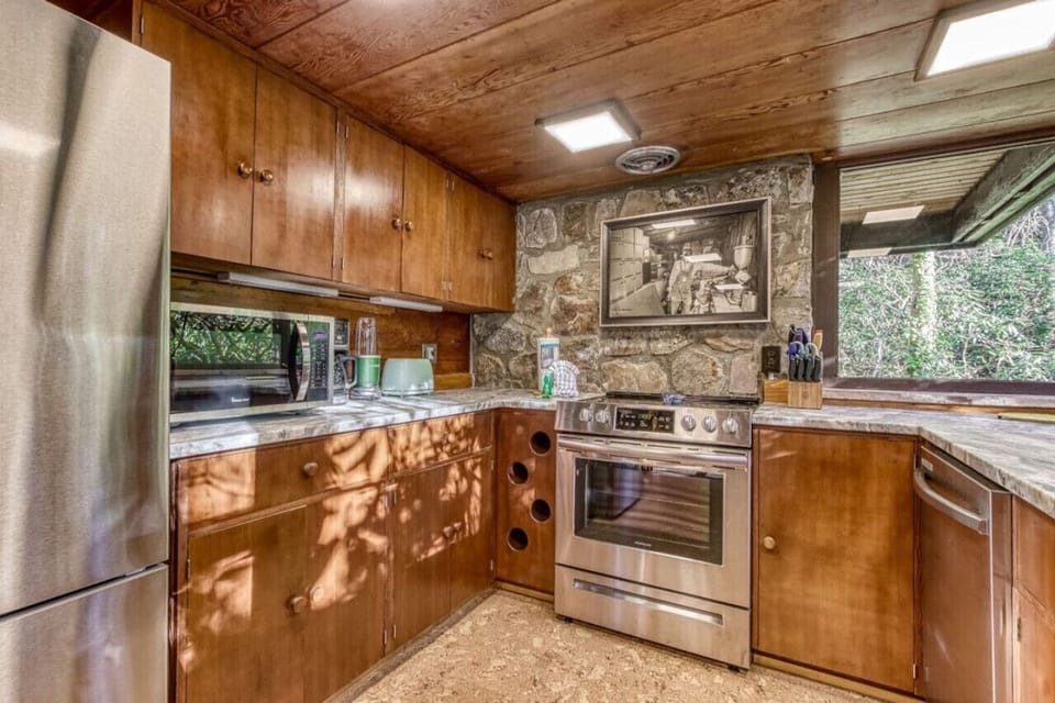 The newly update kitchen with extremely high standards including everything you need to entertain. New Ceramic dishes, beautiful glassware, and expertly restored original cabinets.