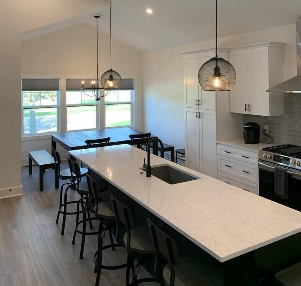 Kitchen, island, and dining room.