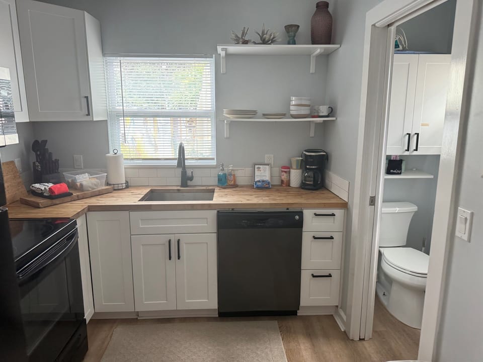 Fully equipped kitchen with full-size refrigerator, dishwasher and everything you need for a comfortable stay.