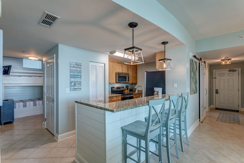 Open floor plan with large eat at bar