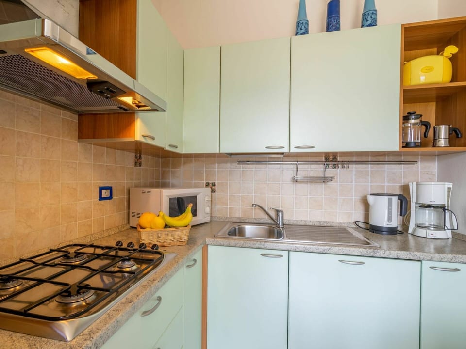 Cabinetry, Kitchen Sink, Countertop, Property, Sink, Tap, Kitchen Stove, Building, Kitchen, Kitchen Appliance