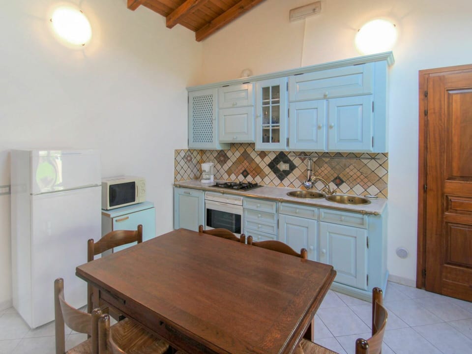 Furniture, Property, Table, Cabinetry, Wood, Lighting, Interior Design, Wood Stain, Chair, Floor