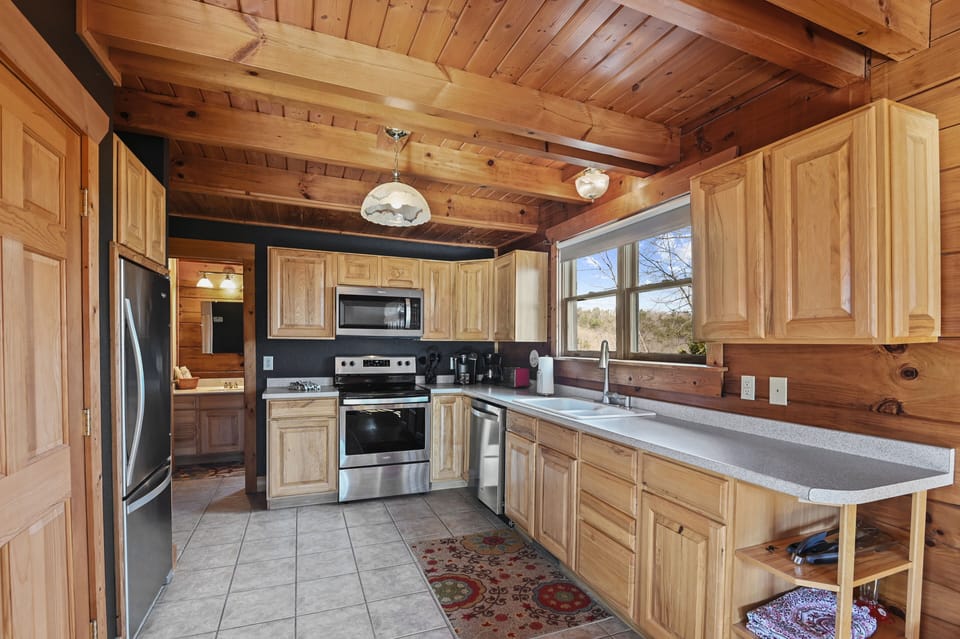 Fully stocked kitchen with stainless steel appliances