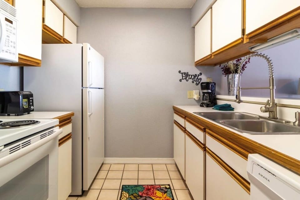 Kitchen equipped with full size Appliances.