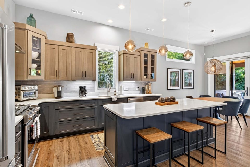 Open living, dining, and kitchen on the main level.
