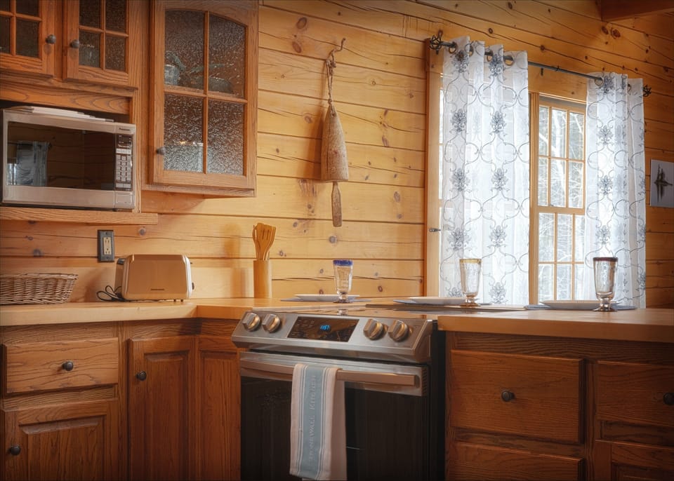 Kitchen has new appliances and a breakfast bar