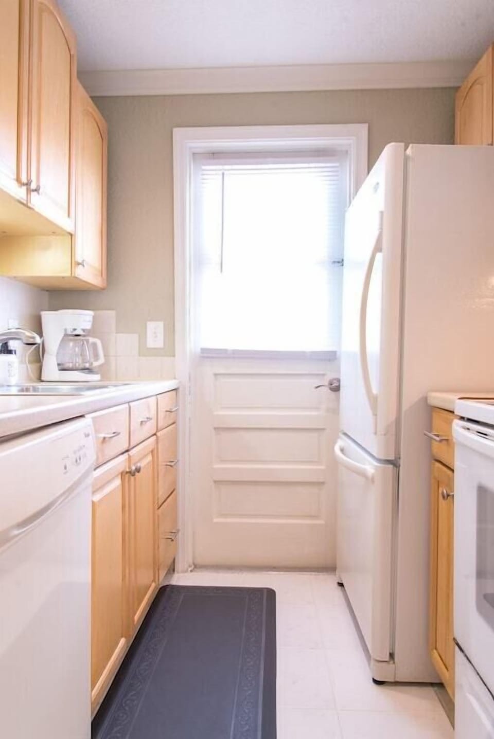 Fully stocked kitchen includes all major full size appliances (refrigerator, microwave, oven, dishwasher).