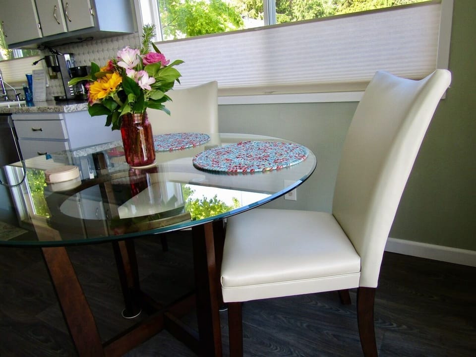 Breakfast nook with water views out slider to deck
