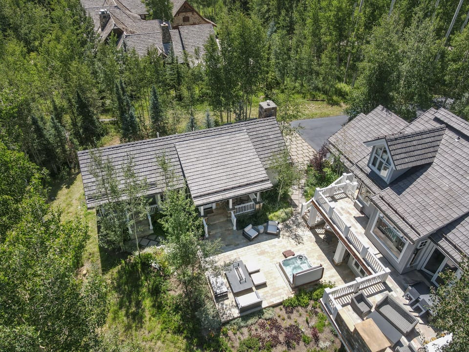Summer view of rental cottage on left