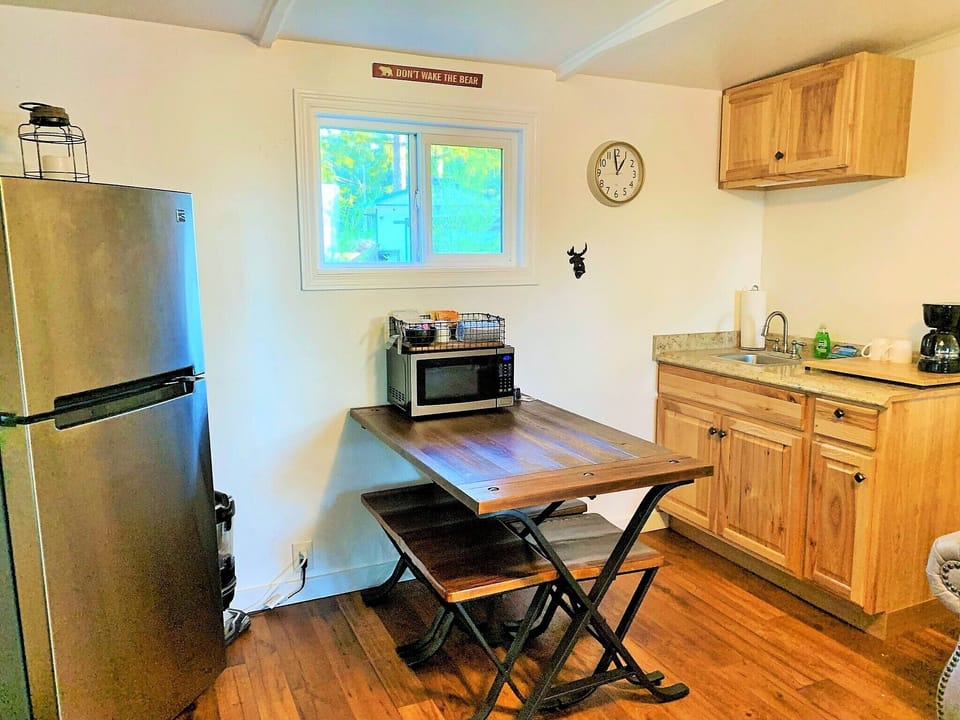 full size fridge, small sink, dishes for 4. 