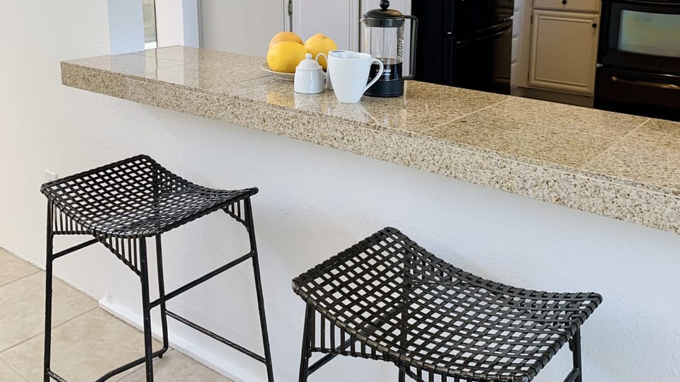 The breakfast bar is the ideal place for a quick snack or casual conversation.