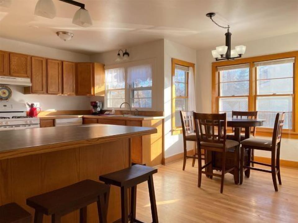 Large, sunny kitchen and dining room with room for your group to gather together