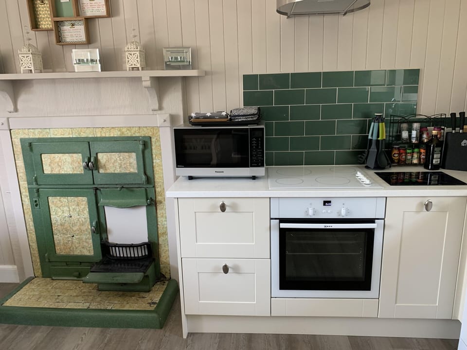 The orginal range oven beside the modern Neff cooker