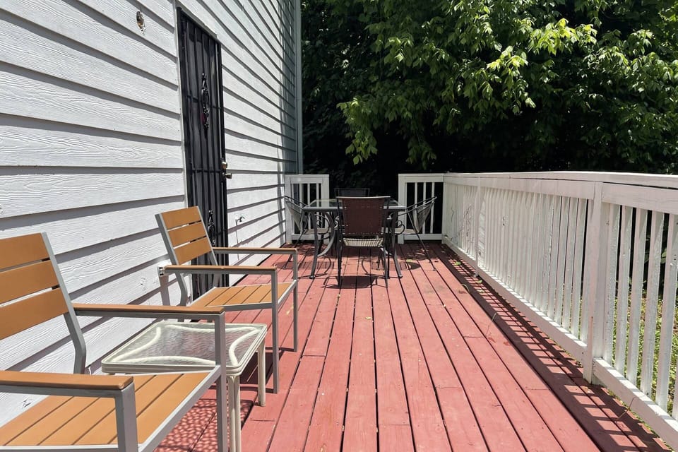 Back deck- a great place to relax after a busy day touring the city or working.  Charcoal Grill for those that love to cook.
