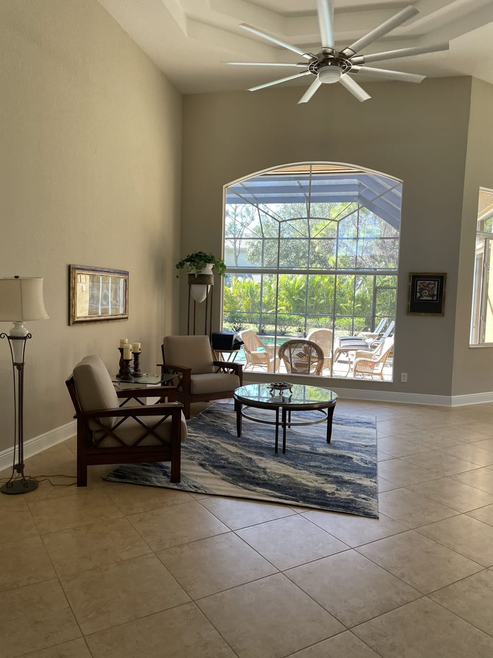 Entry seating area showing lanai seating area through the window. 