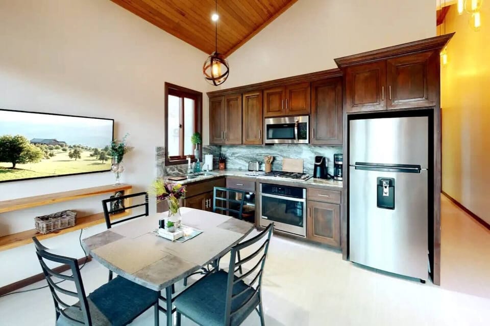 Coastal Elegance Meets Culinary Excellence! This kitchen offers a perfect blend of style and practicality. Prepare meals with ease while enjoying the timeless beauty of the beach just beyond the windows.