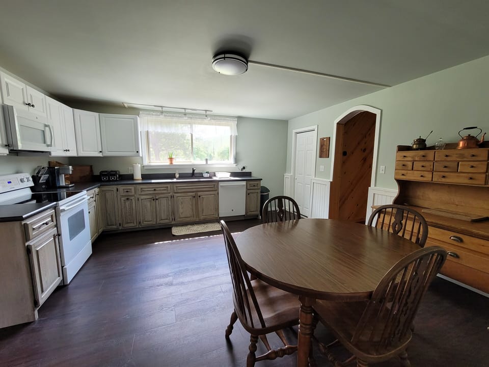 In-kitchen table for 4 people; plus Alxea speaker for music and other info