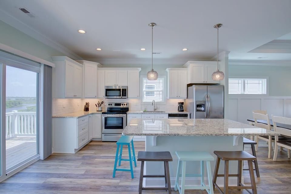 Modern kitchen w/ island that sits 8, new appliances and sound side deck