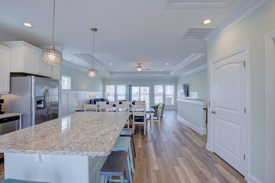  Kitchen opens to dining to living area, to ocean view deck w/ hot tub